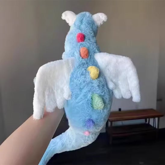 Peluche dragon magique